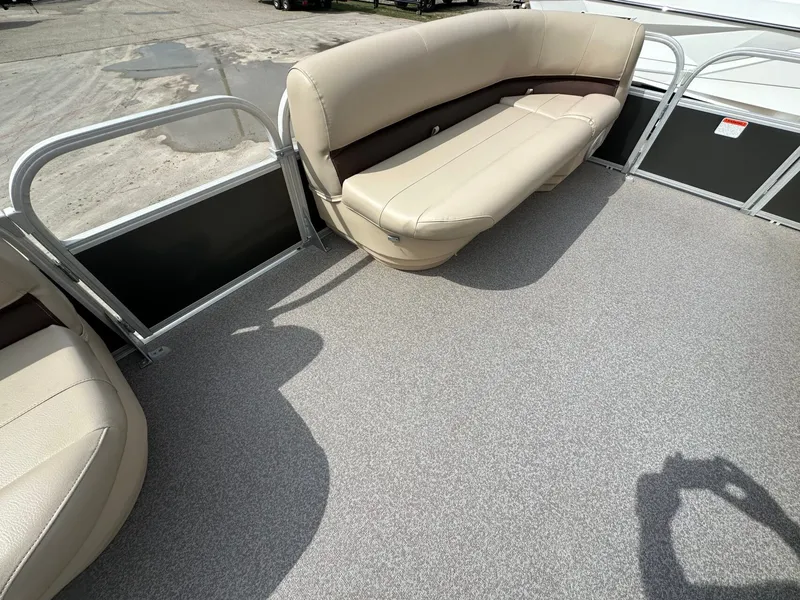 Slide: The Image of Interior of a 2017 Tracker 20 DLX pontoon boat with beige seating. - 17