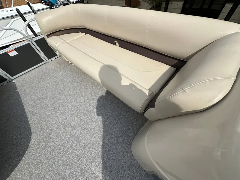 Slide: The Image of Interior of a 2017 Tracker 20 DLX boat with beige seating. - 19