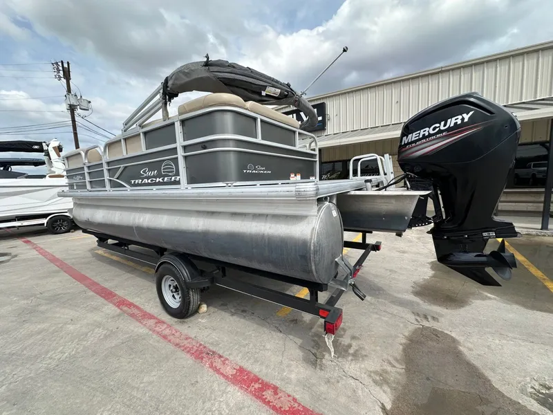 Slide: The Image of 2017 Tracker 20 DLX pontoon boat with Mercury engine on trailer. - 3