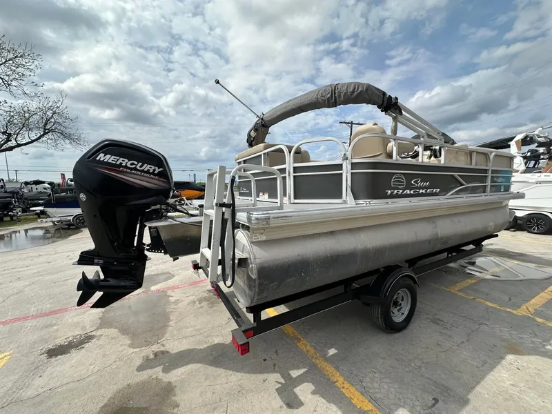 Slide: The Image of 2017 Tracker 20 DLX pontoon boat with Mercury engine on trailer. - 5