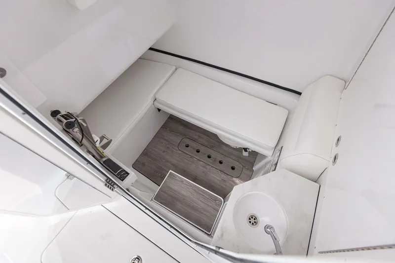 Slide: The Image of Manufacturer Provided Image: 2025 Sportsman Open 322 Center Console interior with seating and sink. - 20
