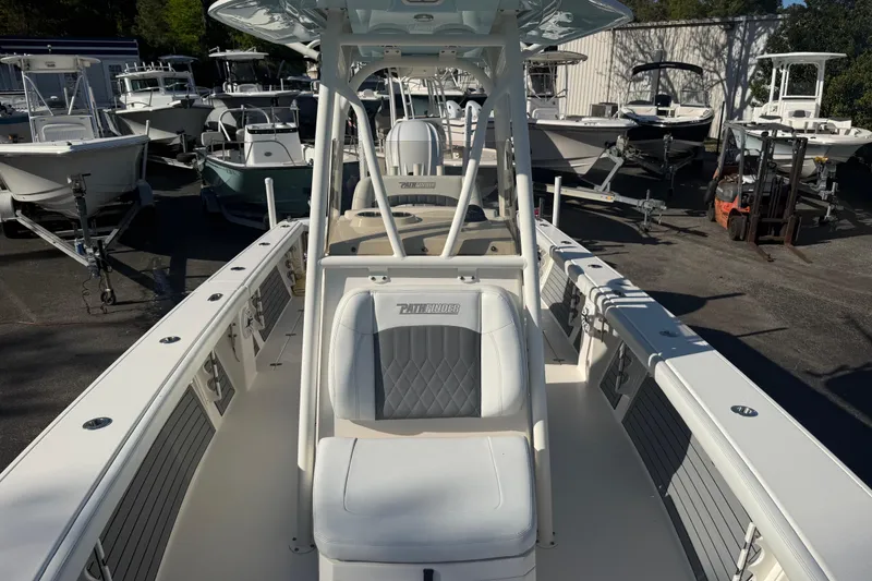 Slide: The Image of 2022 Pathfinder 2700 Open boat displayed in a marina with other vessels. - 3