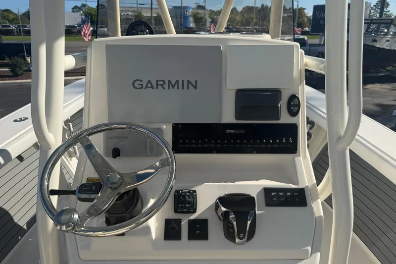 Slide: The Image of 2022 Pathfinder 2700 Open boat console with Garmin navigation system and steering wheel. - 4