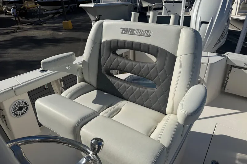 Slide: The Image of Luxury seating on 2022 Pathfinder 2700 Open boat, featuring quilted design and armrests. - 6