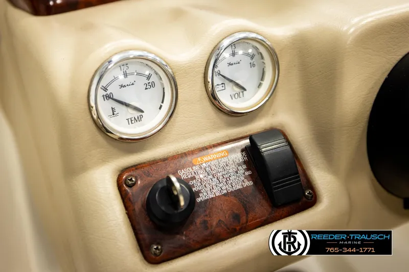 Slide: The Image of Dashboard of 2006 Glastron GX 235 boat with temperature and voltage gauges. - 31