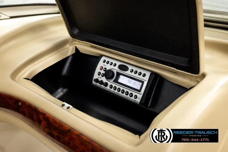 Slide: The Image of 2006 Glastron GX 235 boat stereo system in dashboard compartment. - 35