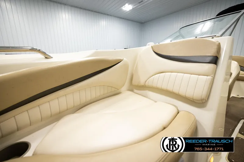 Slide: The Image of 2006 Glastron GX 235 boat interior with beige seating and sleek design. - 37