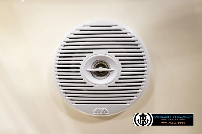 Slide: The Image of White marine speaker on a 2006 Glastron GX 235 boat, Reeder-Trausch Marine logo visible. - 38