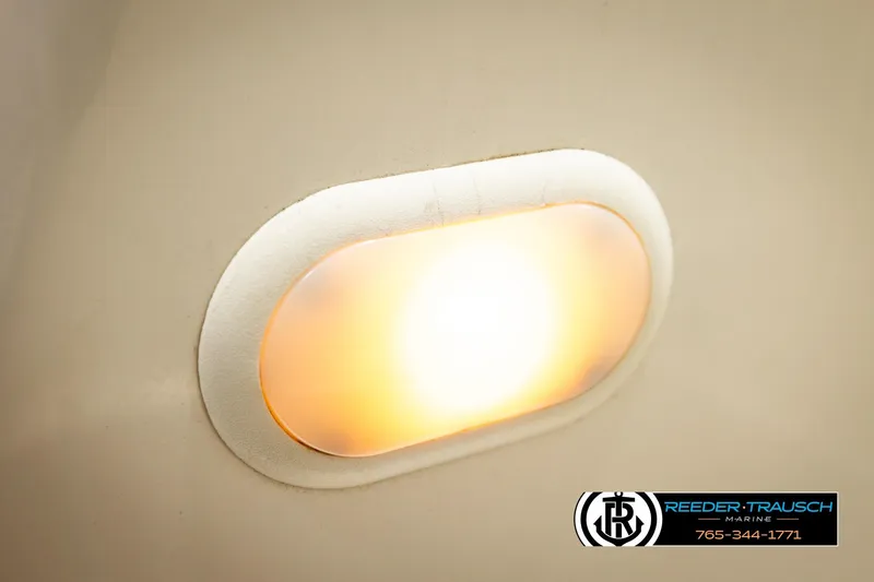 Slide: The Image of Interior light fixture on a 2006 Glastron GX 235 boat, Reeder-Trausch Marine logo visible. - 40