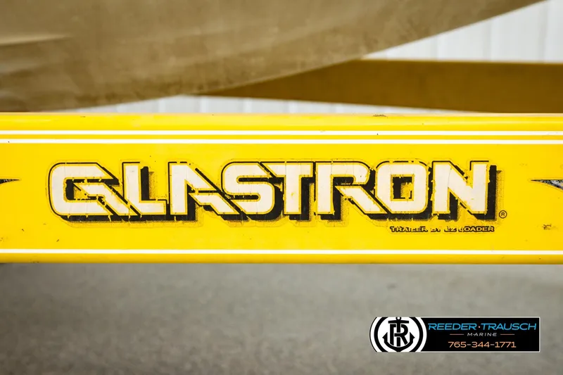 Slide: The Image of Yellow Glastron GX 235 trailer detail, 2006 model, with Reeder-Trausch Marine branding. - 46