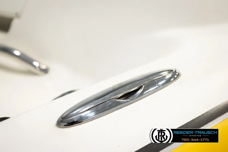 Slide: The Image of Close-up of a 2006 Glastron GX 235 boat cleat, featuring chrome finish. - 51