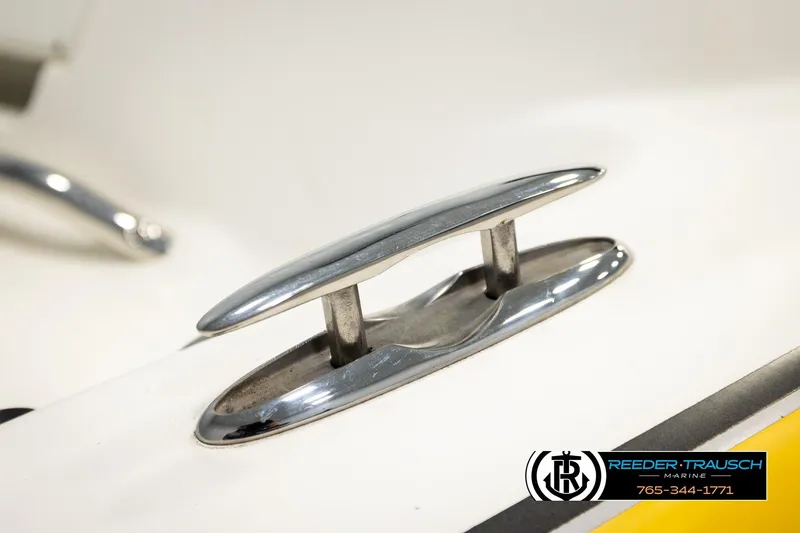 Slide: The Image of Close-up of a 2006 Glastron GX 235 boat cleat, featuring shiny chrome finish. - 52