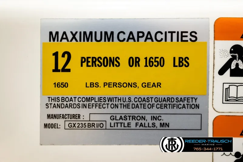 Slide: The Image of 2006 Glastron GX 235 capacity label: 12 persons or 1650 lbs, U.S. Coast Guard compliant. - 53
