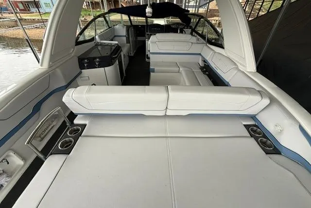 Slide: The Image of 2023 Formula 350 Crossover Bowrider I/O with spacious white seating and sleek interior design. - 5