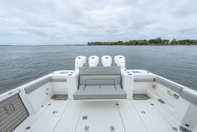 Slide: The Image of 2023 Pursuit S 428 Sport boat with quad engines on open water. - 11