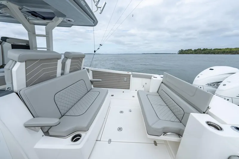 Slide: The Image of 2023 Pursuit S 428 Sport boat with spacious seating on open water. - 12