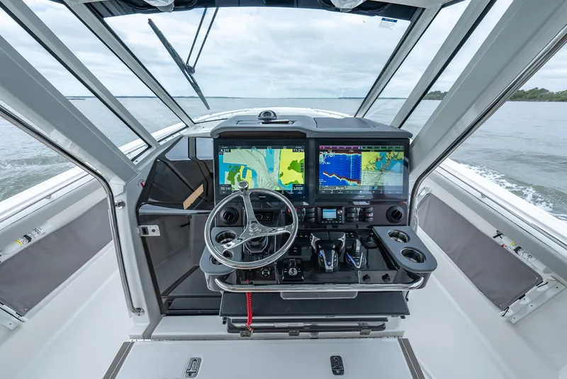 Slide: The Image of 2023 Pursuit S 428 Sport boat helm with advanced navigation displays. - 20