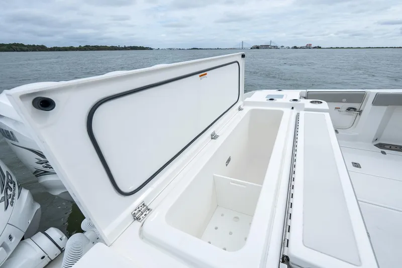 Slide: The Image of 2023 Pursuit S 428 Sport boat with open storage compartment on deck. - 24