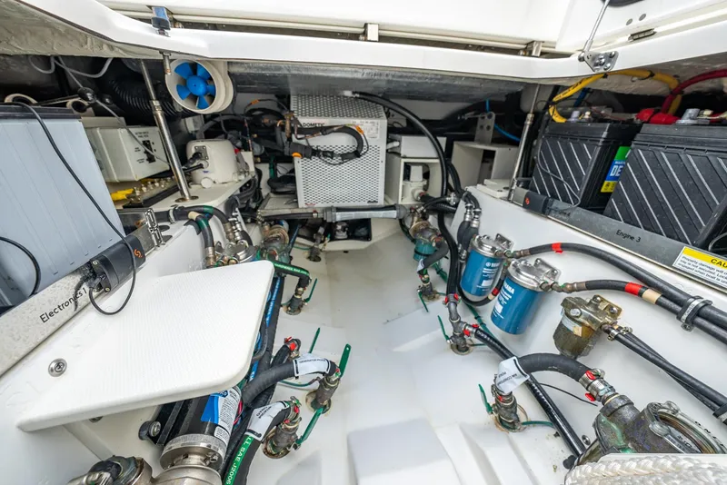 Slide: The Image of Interior view of a 2023 Pursuit S 428 Sport boat engine room. - 39