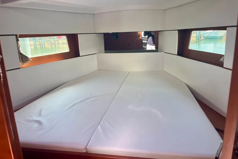 Slide: The Image of Interior cabin of 2016 Beneteau Oceanis 38.1 yacht with white bedding. - 17