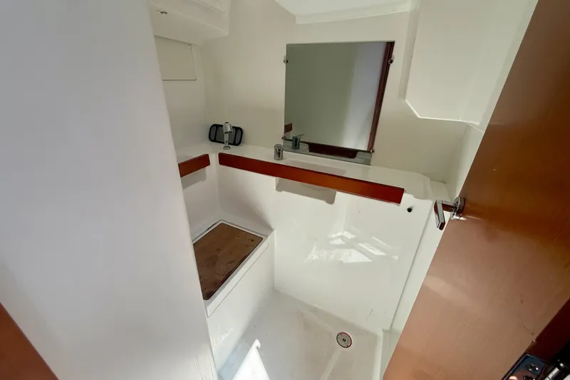 Slide: The Image of Interior of 2016 Beneteau Oceanis 38.1 yacht bathroom with sink and mirror. - 21