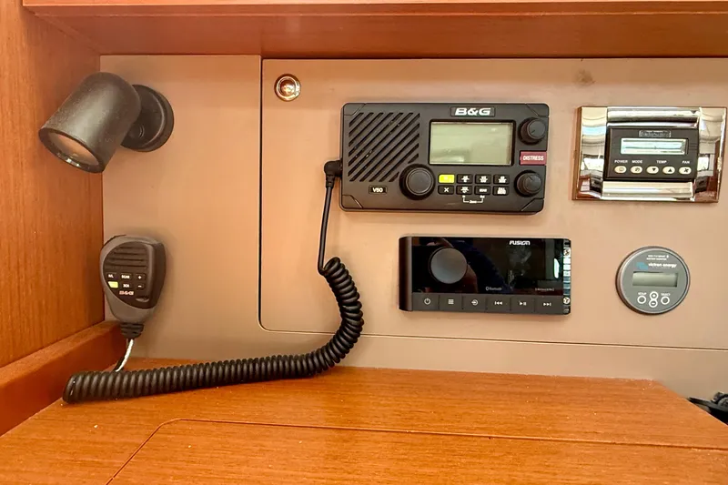 Slide: The Image of Control panel of a 2016 Beneteau Oceanis 38.1 yacht with communication and navigation equipment. - 22