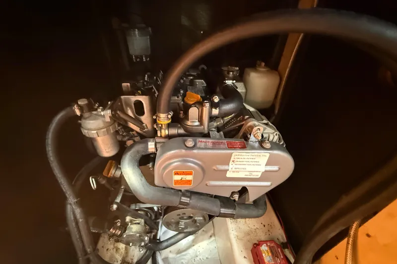 Slide: The Image of Engine of a 2016 Beneteau Oceanis 38.1 sailboat, showcasing mechanical components. - 24