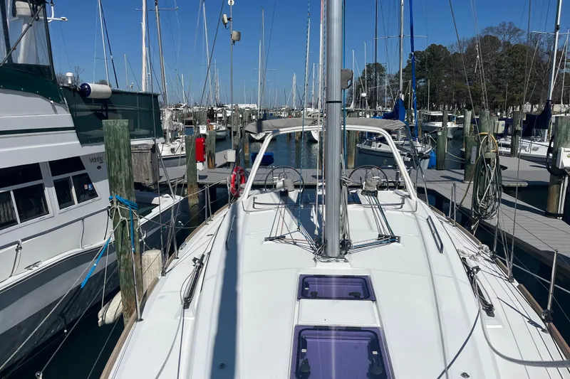 Slide: The Image of Beneteau Oceanis 38.1 sailboat docked at marina, 2016 model, surrounded by other boats. - 3