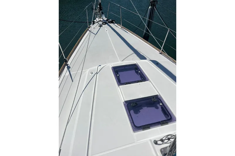 Slide: The Image of 2016 Beneteau Oceanis 38.1 yacht deck with hatches, sailing on calm waters. - 5