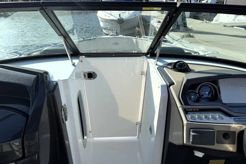 Slide: The Image of 2022 Monterey 255SS Super Sport boat interior with dashboard and open deck view. - 16