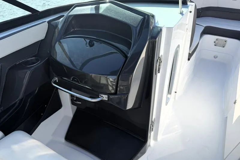 Slide: The Image of 2022 Monterey 255SS Super Sport boat interior with sleek black and white design. - 18