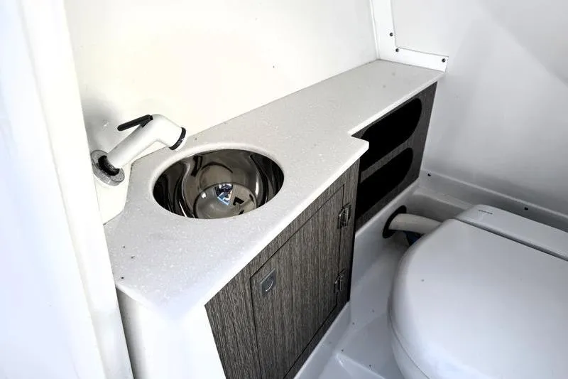 Slide: The Image of 2022 Monterey 255SS Super Sport boat bathroom with sink and toilet. - 21