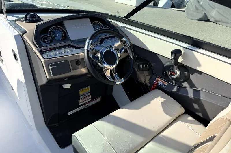 Slide: The Image of 2022 Monterey 255SS Super Sport boat interior with steering wheel and dashboard controls. - 23
