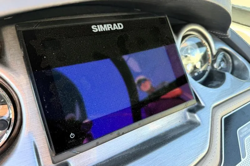 Slide: The Image of Simrad display on 2022 Monterey 255SS Super Sport dashboard. - 25