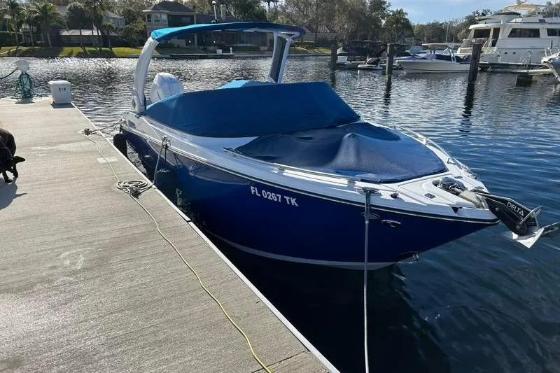 Slide: The Image of 2022 Monterey 255SS Super Sport boat docked at marina with blue cover. - 3
