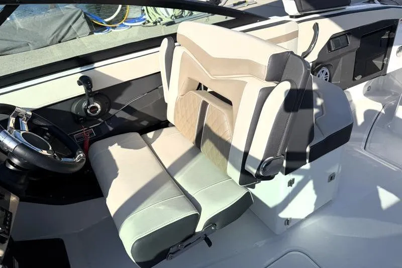 Slide: The Image of 2022 Monterey 255SS Super Sport boat interior with modern seating and steering wheel. - 30
