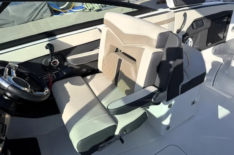 Slide: The Image of 2022 Monterey 255SS Super Sport boat interior with beige and gray seating. - 31