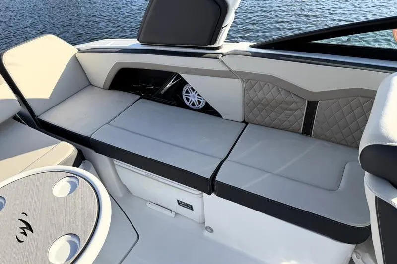 Slide: The Image of 2022 Monterey 255SS Super Sport boat interior with cushioned seating and speaker detail. - 39