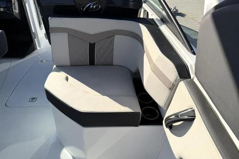 Slide: The Image of 2022 Monterey 255SS Super Sport boat interior with cushioned seating and cup holders. - 40