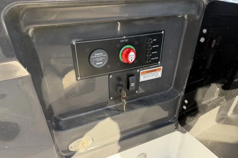 Slide: The Image of Control panel of a 2022 Monterey 255SS Super Sport boat with key ignition. - 41