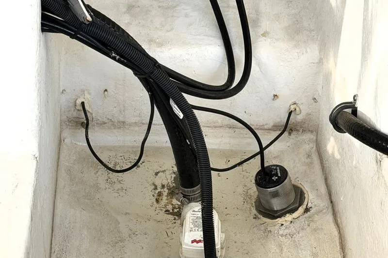 Slide: The Image of Bilge area of 2022 Monterey 255SS Super Sport boat with wiring and pump. - 49