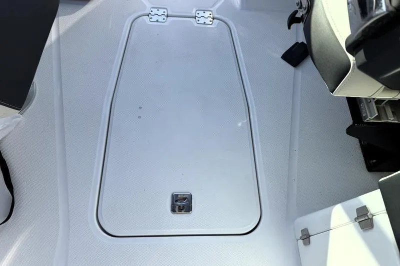 Slide: The Image of Interior view of a 2022 Monterey 255SS Super Sport boat's storage compartment. - 50