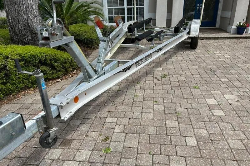Slide: The Image of Boat trailer for 2022 Monterey 255SS Super Sport on brick driveway. - 57