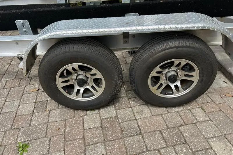 Slide: The Image of Trailer wheels on a 2022 Monterey 255SS Super Sport boat trailer. - 8