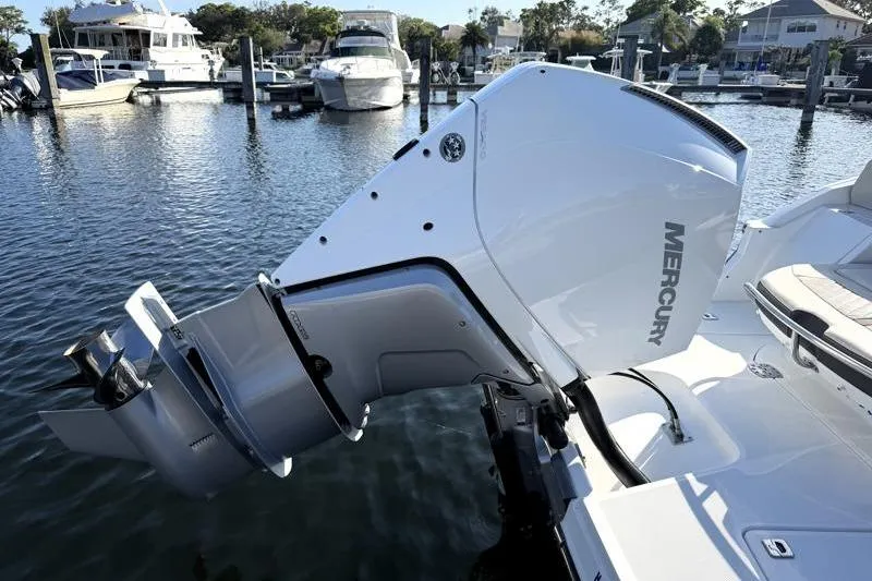 Slide: The Image of Outboard motor on 2022 Monterey 255SS Super Sport boat at marina. - 9