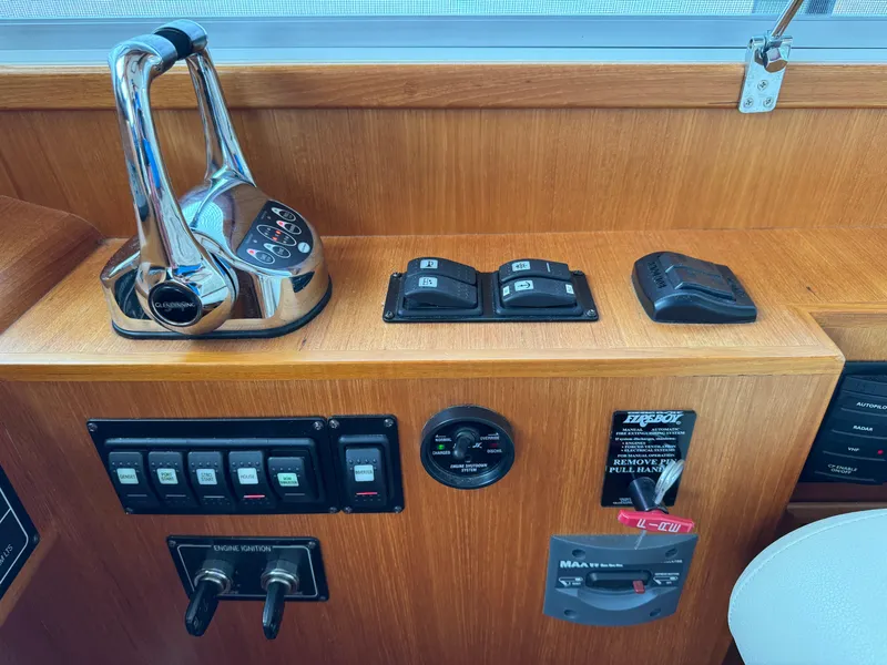 Slide: The Image of Control panel of 2009 Grand Banks 45 Eastbay SX yacht with throttle and switches. - 12