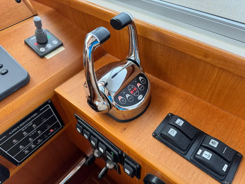 Slide: The Image of Control panel of 2009 Grand Banks 45 Eastbay SX yacht with throttle and switches. - 13