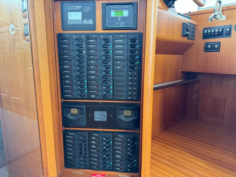 Slide: The Image of Electrical panel on 2009 Grand Banks 45 Eastbay SX yacht, featuring control switches and displays. - 15