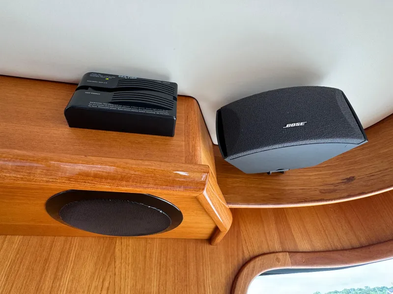 Slide: The Image of Bose speaker and electronic device on 2009 Grand Banks 45 Eastbay SX wooden interior. - 19