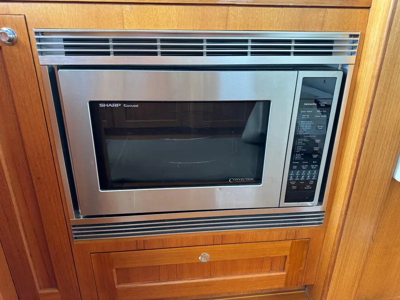 Slide: The Image of Built-in Sharp microwave in 2009 Grand Banks 45 Eastbay SX yacht kitchen. - 24